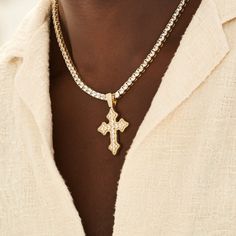 Introducing the Iced Gothic Cross in Yellow Gold - a bold addition to your pendant collection. Crafted with a durable 18k Gold and hand-set stones, this cross is guaranteed to make a statement. Pair this piece with our 5mm Tennis Chain in Yellow Gold for a complete, elevated look. This product is guaranteed for life - GLD will repair the item should you experience any defects in craftsmanship or breakage. Specifications - 35mm x 42mm (Width x Height) - Weight: (Weight can vary +/- 1 gram) - Gold Gothic Cross, Gothic Crosses, Tennis Chain, Vermeil Jewelry, Custom Earrings, Drop Necklace, Pendant Bracelet, Gold Design, Cz Stone