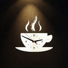 a clock that is on the side of a wall with a coffee cup in it