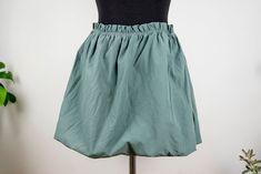 Vintage sage green bubble mini skirt in mint condition. Seems handmade Shell feels cotton polyester blend Lining feels like cotton spandex blend Fits like women size M/L waist 34 cm = 13.4 inches hips open length 42 cm = 16.5 inches Green Cotton Mini Skirt With Elastic Waistband, Green Cotton Bottoms With Gathered Skirt, Green Cotton Mini Skirt For Summer, Green Mini Length Cotton Bottoms, Green Mini Cotton Bottoms, Green Mini-length Cotton Bottoms, Green Cotton Mini Bottoms, Cotton Mini Skirt With Gathered Detail, Short Green Lined Skirt