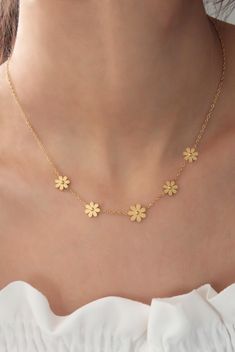 "High-quality gold plated stainless steel flower necklace for women, flower jewelry, dainty necklace, delicate jewelry, girlfriend necklace ✨ Stop worrying about your jewelry being tarnished, discolored, rusted, or scratched with 316L stainless steel.  ✨ The necklace is entirely made of 316L high-quality stainless steel, which makes it more durable in harsh conditions (swimming, showering, and chemical contact). ✨ 316L steel is naturally anti-allergenic, so it won't cause any allergy. ✨ The stainless steel mark is sealed as s-steel on the necklace. ✨ 316L is better than silver and feels like gold; therefore will make a perfect gift for you and your loved ones. ✨ 100% satisfaction guarantee; Return it within 14 days if you feel unsatisfied. ✨ Please don't hesitate to get in touch with me wi Cheap Gold Flower Necklace For Party, Cheap Dainty Gold Flower Necklace, Cheap Dainty Flower Necklace For Gift, Yellow Gold Flower Charm Necklace, Gold-plated Flower Necklace With Clavicle Chain, Gold Plated Flower Necklace With Clavicle Chain, Gold-plated Clavicle Flower Necklace, Dainty Flower Necklaces As A Gift For Her, Feminine Flower Pendant Necklace With Delicate Chain