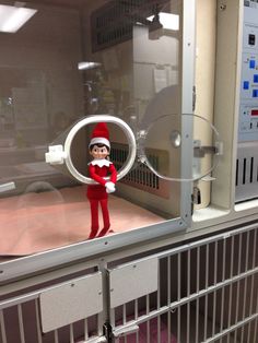 an elf is in the middle of a machine