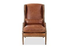 a brown leather chair against a white background