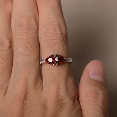 This is a gorgeous handmade creation. Its beauty is its simplicity & Elegance. The 6*6mm trillion garnet is crafted in solid sterling silver and with rhodium plated. It's made to order and it will take about 7 days to make it. All item is sent in a beautiful gift box You can realize more lovely stuff clicking the link https://www.etsy.com/shop/knightjewelry?refshopsection_shophome_leftnav Please leave the correct address and you phone number for delivering successfully. Red Gemstone Ring, January Birthstone Rings, Alexandrite Ring, Promise Rings For Her, Red Gemstones, Garnet Rings, Birthstone Ring, Beautiful Gift Boxes, Black Rings