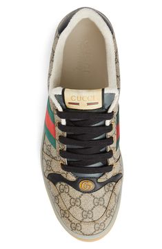 Heritage web stripes angle up the sides of a '70s-inspired, GG Supreme sneaker with enameled double-G hardware, a throwback label and a logo-stamped heel tab. Lace-up style Removable insole Textile upper/textile and leather lining/rubber sole Made in Italy Men's Designer Shoes Gucci Sporty High-top Sneakers, Gucci Lace-up Sneakers For Streetwear, Designer High-top Sneakers With Embroidered Logo, Gucci Low-top Sneakers With Logo, Gucci Leather Sneakers With Logo, Gucci Sporty Sneakers For Streetwear, Designer Sneakers With Logo Detail And Round Toe, Gucci Luxury Sneakers With Branded Insole, Gucci High-top Logo Sneakers