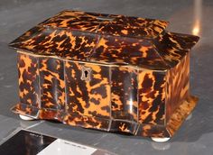 an animal print box sitting on top of a table