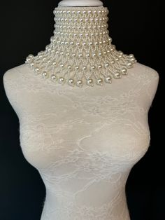 Handmade Chocker Style pearl shoulder body Jewellery.  High quality pearls. Statement piece. Perfect for special events, fashion shows, bridal, special evenings, weddings.  Stunning Ivory pearls with bead detail.  UK Size 6-12 Party Pearl Drop Backdrop Necklace, White Pearl Backdrop Necklace, Party Pearl Necklace, Elegant Beaded Bridal Necklace For Parties, White Pearl Chain Backdrop Necklace For Party, Party Pearl Backdrop Necklace, Party Backdrop Necklace With White Pearl Chain, Party White Backdrop Necklace With Pearl Chain, Pearl Backdrop Necklace For Parties