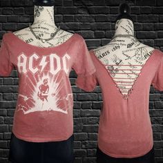 two mannequins wearing t - shirts with the word ac / dc printed on them