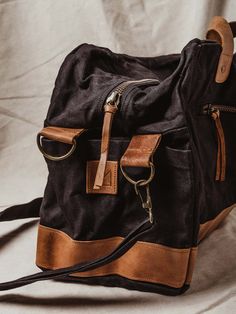 Say hello to your new getaway go-to! This spacious weekender bag is hand-crafted with durable canvas and genuine leather – that means it’s made to last, whether it’s a long weekend away or a two week trip to Paris (even with baggage handling!) And say goodbye to shoulder aches once and for all, no matter how long that airport line is — an adjustable strap configuration offers multiple ways to carry this bag. Throw it over your shoulder with the adjustable shoulder strap, grab the top carry handl