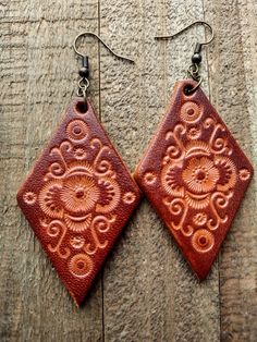 Bohemian Hand-tooled Leather Earrings, Artisan Handcrafted Brown Jewelry, Adjustable Southwestern Brown Earrings, Rustic Hand Tooled Leather Jewelry, Bohemian Leather Earrings, Brown Bohemian Concho Earrings, Festival Handmade Leather Earrings, Handmade Leather Earrings For Festivals, Handmade Southwestern Leather Earrings