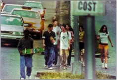 a group of people walking down the street