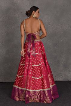 Flaunt your Indian style on festive and wedding occasions in this exquisite pink and purple Banarasi embroidered lehenga. The lehenga comes with a matching dupatta. Festive Pink Lehenga With Cutdana Detail, Festive Pink Lehenga With Cutdana, Festive Pink Cutdana Lehenga, Transitional Reception Anarkali Set In Pink, Pink Art Silk Lehenga With Cutdana, Pink Cutdana Art Silk Lehenga, Brocade Floor-length Choli For Reception, Floor-length Brocade Choli For Reception, Pink Transitional Wedding Sharara