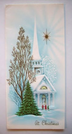 a christmas card with a church and tree