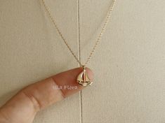 Beautifully crafted Sail Boat necklace, see through between the sails and top. Tiny details from the curve of the boat to the steerer, Super Cute and Dainty -18k Gold Dipped -18k White Gold Dipped * Brass Casting * Lead & Nickel Free ◾ MEASURES * Necklace Length: 16" plus 1.5" adjustable chain * Pendant Width: 0.5" * Pendant Height: 0.7" * Closure: Lobster Claw ◾ CARE: * Treat delicately to extend its life. Clean only with a soft, dry cloth. * Chain/Pendants are gold plated so please avoid conta Sailboat Jewelry, Toddler Earrings, Sailboat Necklace, Hand Jewelry Rings, Jewelry Layering, Ocean Necklace, Casual Jewelry, Sail Boat, Classy Jewelry