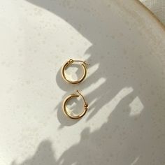 If you're the type of person who relies on staples for everyday wear, snag these classic hoops that will last, wear after wear. An elevated version of our gold fill hoops with an endless snap closure. Sold as a pair. Each purchase comes with an elegant, vegan leather box for storing + caring for your jewelry. DETAILS14k Solid Gold | 15mm hoops Simple 14k Gold Tarnish Resistant Huggie Earrings, Simple 14k Gold Tarnish-resistant Huggie Earrings, Everyday Recycled Gold Huggie Earrings, Simple 14k Gold Huggie Earrings For Everyday, Simple Everyday 14k Gold Huggie Earrings, Everyday Simple 14k Gold Huggie Earrings, Simple Yellow Gold Tarnish Resistant Huggie Earrings, Simple Yellow Gold Tarnish-resistant Huggie Earrings, Classic Everyday Hypoallergenic Huggie Earrings