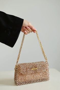 Crystal beaded bags are popular choices for formal occasions, evening events, or any time when a touch of glamour is desired. They can add a statement-making element to an outfit and are often chosen to complement elegant dresses or evening gowns. The beaded texture of the bag not only adds visual interest but also provides a tactile and luxurious feel. Whether you're treating yourself or searching for the perfect gift for a fashion-forward friend, this crystal beaded bag is sure to impress. Elevate your style with this eye-catching accessory and turn heads wherever you go. Trendy Mobile Phone Shoulder Bag For Parties, Trendy Shoulder Box Bag For Party, Party Mobile Phone Shoulder Box Bag, Party Mobile Phone Box Bag, Party Clutch Shoulder Bag With Mobile Phone Holder, Party Clutch With Mobile Phone Bag, Trendy Mobile Phone Evening Bag For Parties, Trendy Handheld Shoulder Bag For Party, Trendy Mobile Phone Bag For Parties