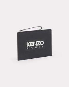 This large leather pouch offers a minimalist design with a splash of style. It features a large 'KENZO Paris' logo printed and embossed on the side. This ingenious and functional item is ideal for carrying all your day-to-day essentials thanks to the large interior compartment and wrist strap for easy carrying.
Large 'KENZO Emboss' leather pouch.'KENZO Paris' printed and embossed logo.'KENZO Paris' interior embossed logo.One flat exterior pocket.One interior card slot.Zipped fastening with wrist Modern Leather Bags With Logo Print, Designer Leather Bag With Logo Print, Modern Business Pouch With Dust Bag Included, Modern Rectangular Pouch, Modern Rectangular Bags With Engraved Logo, Modern Rectangular Bag With Engraved Logo, Modern Everyday Bags With Logo Tag, Modern Bags With Logo Print For Daily Use, Modern Pouch Bag With Logo