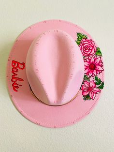 Standard brim festival style hat.  Barbie themed!  Design was burned in and painted.  One size fits all with adjustable ribbon in the brim. Adjustable Fun Hat For Western-themed Events, Pink Fedora Hat For Festival, Fun Adjustable Mini Hats For Rodeo, Fun Hat With Curved Brim For Country Events, Handmade Pink Fedora With Flat Brim, Adjustable Hand Painted Brimmed Sun Hat, Fun Short Brim Rodeo Hat, Fun Short Brim Hat For Rodeo, Spring Festival Costume Hat With Short Brim