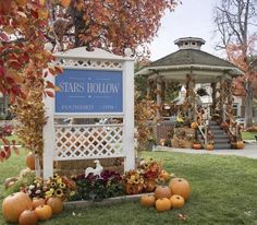 there is a sign that says stars hollow surrounded by pumpkins