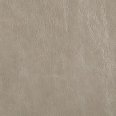 a close up view of a light brown leather texture