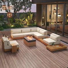 an outdoor living room with wood flooring and furniture