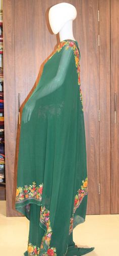 A Marvellous Embroidered Kashmiri Saree which you can wear at any party or a wedding.- - - - - - - - - - - - - - - - - - - - Product DetailsCondition: Brand NewEmbroidery: Kashmiri Aari embroideryColour: GreenF A B R I CSaree: Viscose Georgette Blouse: Indian CrepeF I N I S H- UnstitchedYou can get it stitched locally.- StitchedWant your blouse ready to wear, let us know the style you want and we will stitch it for you.***PLEASE NOTE: We would require you to share certain precise body measuremen Embroidered Semi-stitched Floor-length Churidar, Floor-length Embroidered Salwar Kameez For Diwali, Semi-stitched Floral Embroidery Salwar Kameez Floor-length, Semi-stitched Floor-length Salwar Kameez With Floral Embroidery, Floor-length Salwar Kameez With Floral Embroidery, Semi-stitched, Floor-length Georgette Anarkali Set For Traditional Ceremonies, Georgette Anarkali Set For Traditional Ceremonies During Diwali, Unstitched Long Embroidered Anarkali Set, Long Unstitched Embroidered Anarkali Set