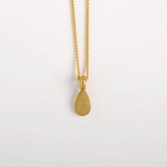 This Egg Shaped Pendant is made of 22k Solid Gold and it is a part from our 'Middle Line' collection. Metal: 22k yellow solid goldGold pendant length: approx. 10 mm (0.4") | width: 6.5 mm (2.5'').Inner diameter of the link: approx. 3 mm. We can make it larger at your request.We chose to use 22 karat gold for our weight pendants, for their high density. It's a small, concentrated pendant, a small object with a satisfying weight to it, keeping it centered on its chain.Whether around the neck, clos Minimal Pendant, Minimal Gold, Wedding Pendant, Solid Gold Necklace, Gold Necklace Women, 22k Gold, Gold Pendant, Charm Necklace, Womens Necklaces