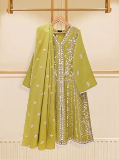 Vibrant and fashionable embroidered lawn shirt with pant and dupatta perfect for adding a touch of elegance and style to your wardrobe. Made from high-quality lawn fabric, this shirt offers comfort and breathability, making it an ideal choice. Length : 46" Pants Fabric : Lawn Dupatta Fabric : Lawn Green Churidar With Mirror Work And Long Sleeves, Green Long Sleeve Churidar With Mirror Work, Navratri Lawn Suit With Naqshi In Traditional Drape, Traditional Drape Lawn Suit With Naqshi For Navratri, Green Naqshi Sharara For Eid, Green Anarkali With Naqshi Detailing, Cambric Lawn Suit For Wedding And Festivals, Green Cotton Anarkali Set With Mirror Work, Green Sharara With Naqshi For Festivals