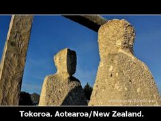 two stone statues with the words tokoroa aoteaka / new zealand