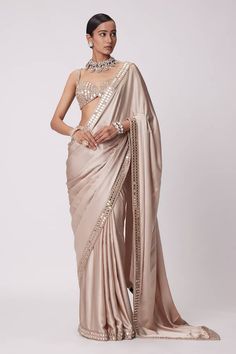 Beige satin saree with a mirror embroidered border. Paired with a padded mirror embroidered blouse. - Aza Fashions Gold Satin Saree, Satin Sari, Mirror Blouse, Mirror Embroidery, Weddings Receptions, Drape Saree, Indian Wedding Wear, Satin Saree, Gold Satin