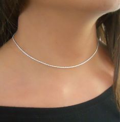 "Delicate Sterling Silver Rope Chain Choker Necklace, Minimalist Silver Necklace for Women Brighten up your day with this gorgeous choker! The perfect necklace to wear on its own or layer with other necklaces. It will be a great addition to your jewelry collection and it will pair well with both informal and formal outfits. ⊹ L e n g t h 13\" + 3\" extender ⊹ D e t a i l s Sterling silver ⊹ Read about my shop Processing and Delivery times, Payment options, Packaging and Care instructions here: h Cheap Silver Choker With Clavicle Chain, Cheap Minimalist Adjustable Choker, Cheap Clavicle Chain Necklaces For Women, Cheap Silver Pendant Choker, Cheap Minimalist Clavicle Chain Choker, Cheap Dainty Silver Choker, Cheap Adjustable Minimalist Choker, Minimalist Silver Necklace, Minimalist Necklace Silver