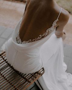 the back of a woman's white wedding dress