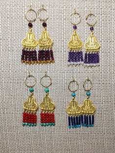 SPECTACULAR genuine natural gemstone earrings on 14k gold filled hoops! These earrings are perfect to wear with historic clothing from ancient Greece, Rome and Persia as well as India and China, Byzantium.... Please use the drop down menu to see each pair of earrings in detail. These earrings can be switched onto french wires for no extra charge. All of these earrings are on either 14k gold fill or sterling silver hoops or ear wires. The other metal components are as follows: The crescent tops a Gold Laurel Wreath, Historic Clothing, Gold Filled Hoops, French Wire, Coral Turquoise, Sterling Silver Hoops, Ancient Greece, Historical Clothing, Silver Hoops