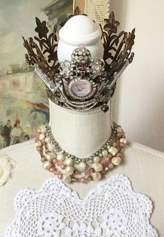 Vintage lot of 3, sold together only. 2 bead necklaces from the 50s and one pair of clip earrings. First necklace is a beautiful pink and dusty pink purple two-strand necklace with aurora borealis pink and textured creamy satin white faux pearls. Hook closure. 15-16 inches. Second necklace is a sparkly aurora borealis rhinestone and dimpled faux pearl necklace. About 15 inches. Clip earrings measure 1.5 inches long, made of elegant grayish purplish faux pearls and shimmering aurora borealis. Wea Vintage Jewelry With Bead Caps And Round Beads, Vintage Jewelry Bead Caps For Jewelry Making, Victorian Beaded Jewelry For Vintage Events, Whimsical Beaded Jewelry For Wedding, Vintage Bead Caps Jewelry For Party, Vintage Pink Beaded Necklace As A Gift, Vintage Party Jewelry With Bead Caps, Vintage Pink Jeweled Necklace, Vintage Pink Beaded Necklaces For Jewelry Making