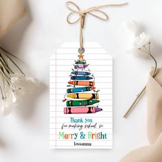 a gift tag that says thank you for making books merry and bright