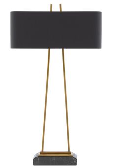 a lamp with a black shade on it and a gold metal frame around the base