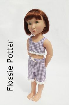 a doll is standing with her hands on her hips