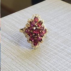 New. 10k Rhodolite Garnet & Diamond Ring Size 7. Rhodolite Garnets Are Amazing They Have A Tinge Of Pink With The Red. Genuine Diamonds Around The Outside. This Has Excellent Finger Coverage. Never Worn, New Old Stock. Great Price! See All Pics! Check My Reviews-Over 900 5 Star Reviews! See My Other Listings For Sterling Silver, Solid 10k, 10kt, 417 , 585, Solid 14k, 14kt Solid 18k, 18kt, Diamonds, Sapphire, Emerald, Garnet, Jade, Amethyst, Citrine, Ruby, Topaz, Other Precious Stones, And Other Art Deco Wedding Ring Vintage, Heirloom Garnet Cluster Ring With Gemstones, Yellow Gold Ruby Cluster Ring With Accent Stones, Garnet Cluster Jewelry For Anniversary, Garnet Gemstone Cluster Ring In Fine Jewelry Style, Fine Jewelry Garnet Cluster Ring With Gemstones, Formal 14k Gold Cluster Ring With Gemstone Accents, Italy Jewelry, Garnet And Diamond Ring