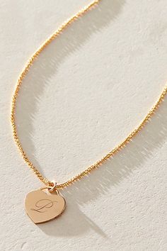 Just as effortless as it is elegant, this stunning necklace features a heart-shaped pendant with gorgeous cursive engraved initial for the ideal finishing touch. * 14k Gold Filled wheat chain * Personalized, laser engraved, 14k Gold Filled 12x14mm heart charm * Length: 18" * 5 days of production | Set & Stones Personalized Alice Necklace at Free People in Gold Personalized Gold Heart Necklace With Adjustable Chain, Gold Heart-shaped Custom Necklace For Personalized Gift, Personalized Heart-shaped Yellow Gold Charm Necklace, Heart-shaped Engraved Necklace For Personalized Gift, Personalized 14k Gold-filled Heart Pendant Jewelry, Engraved Initials, Stunning Necklace, Heart Charm, Laser Engraved