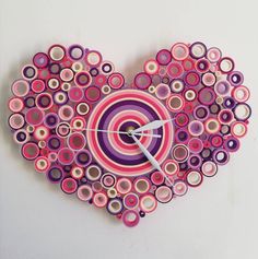 a heart shaped clock made out of circles