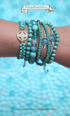 Cross Turquoise Bracelet, Cross Bracelet , Summer Boho Chic Bracelet, Cross Turquoise  Bracelet, Friendship Bracelet  The ultimate SUMMER BOHO CHIC bracelet . A Cross  bracelet for everyday use so unique and so beautiful .... The perfect gift for you and your loved ones  Perfect for Summer time as it is very beautiful on its own or layered with your other favourite pieces  Features turquoise sparkling crystal beads a beautiful gold cross with tiny turquoise colour beads.  This unique bracelet fi Turquoise Beaded Bangle Bracelet Gift, Turquoise Beaded Bangle Bracelet For Gift, Turquoise Bangle Beaded Bracelet For Gift, Spiritual Hand Wrapped Turquoise Friendship Bracelets, Spiritual Turquoise Hand Wrapped Friendship Bracelets, Spiritual Hand-wrapped Turquoise Friendship Bracelets, Turquoise Wrap Bracelet With Round Beads As Gift, Turquoise Stackable Friendship Bracelets As Gift, Turquoise Spiritual Wrap Bracelet With Round Beads