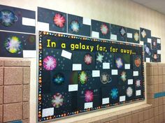 a bulletin board with pictures on it in a hallway for students to write and draw