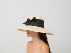 Aguacate Extra Long Brim Hat with Twist Bow 100% Toquilla straw. This natural fiber is known for its quality and beauty. The perfect beach-to-city accessory. Each hat takes approximately two to three days to weave by hand by our Ecuadorian artisans, and after pressed for shape. Indulge in luxury with our Aguacate Extra Long Brim Hat. Handmade with toquilla straw, this hat features a stylish twist bow for a sophisticated touch. Stay protected from the sun in style and elevate your look with this Chic Adjustable Panama Hat In Palm Leaf, Elegant Straw Hat With Upf 50+, Chic Palm Leaf Hat For The Beach, Elegant Natural Straw Hat For Travel, Chic Natural Color Palm Leaf Hat, Chic Toquilla Straw Panama Hat With Wide Brim, Chic Wide Brim Panama Hat In Toquilla Straw, Chic Adjustable Toquilla Straw Sun Hat, Chic Cream Toquilla Straw Sun Hat