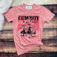 Cowboy Killer! Kill 'Em In This Pink Acid Wash Tee Shirt Country Skeleton Wranglin On A Horse Print 100% Cotton S: 19 Inches Armpit To Armpit/29 Inches In Length M: 21 Inches Armpit To Armpit/30 Inches In Length L: 22.5 Inches Armpit To Armpit/31 Inches In Length Western Style Washed Cotton Tops, Pink Distressed Graphic Tee, Fitted Graphic Print Tops For Rodeo, Pink Distressed Cotton Tops, Fitted Crew Neck Top For Rodeo, Trendy Cotton T-shirt For Rodeo, Short Sleeve Top For Rodeo In Spring, Short Sleeve Tops For Rodeo In Spring, Western Cotton Tops With Graphic Print