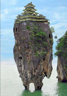 an island in the middle of the ocean with a castle on it's head