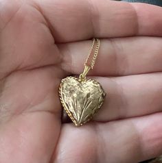 Vintage 12K GF Gold Filled Heart Shaped Engraved Names 1974  Locket Necklace 18" Offered here is a vintage 12k GF gold filled darling heart shaped engraved flower locket necklace measuring; 18" long. The locket is 1.5" x 1.5". It opens on a hinge to reveal 2 compartments for photographs. Engraved :Love Suzzy Sharron Boris 12-26-74 The bail is stamped 12K Gold Filled, but it is too small to photograph.   In nice, sturdy, excellent condition and may have very minimal age related wear Weighs; .14oz Heart Shaped Locket Aesthetic, Affordable Vintage Heart-shaped Jewelry, Vintage Gold Heart Locket, Vintage Open Heart Jewelry For Mother's Day, Collectible Heart Cut Jewelry For Valentine's Day, Heart Cut Jewelry For Valentine's Day Collectibles, Heart Cut Collectible Jewelry For Valentine's Day, Collectible Yellow Gold Necklace With Heart Charm, Vintage Double Heart Necklace For Anniversary