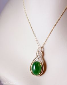 "Here is a beautiful translucent large oval green nephrite jade pendant set with pave diamonds in solid 18KT yellow gold. The jade is set in a double infinity love knott halo setting and is surrounded by pave set round diamonds. The jade is about 14x18mm and is approx. 14.45 carats. The total weight of the brilliant cut round white diamonds is 0.49 carats. The pendant is about 1 1/2\" long. The chain is 14KT gold and is 16\" long. If you do not want the chain, please convo us and we will adjust Elegant Oval Jade Jewelry, Elegant Oval Cabochon Jade Jewelry, Jade Pandent, Jade Accessories, Jade Necklace Pendant, Jade Design, Jade Jewellery, Double Infinity, Green Stone Pendant