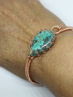 "This is a beautiful handmade piece created by Mimi.  This bracelet is made with a 16 and 26 gauge  bare copper wire and. It is weaved and the labradorite cabochon is Viking weaved. Two spirals fee the stone.. The circumference is approximately 2.5\". The length of the bracelet is about 7.5\".  The closure is hook and eye Copper has a natural oxidation that occurs over time. It really gives it an antique or vintage look. If you want a brighter look you can clean it with a simple solution of lemon and salt. Then rinse well in water." Handmade Turquoise Copper Bracelets, Handmade Turquoise Copper Bracelet, Bohemian Rose Gold Wire Wrapped Bracelets, Bohemian Rose Gold Copper Jewelry, Unique Bronze Wire-wrapped Bracelets, Unique Bronze Wire Wrapped Bracelets, Unique Wire Wrapped Bronze Bracelets, Artisan Wire Wrapped Copper Bracelets, Artisan Copper Wire Wrapped Bracelets