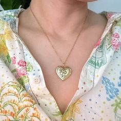 The Nostalgic Heart Initial Open Locket Necklace adds a touch of vintage charm to any outfit. The heart-shaped locket is perfect for everyday wear and can be layered with other necklaces for a unique look. Share your initial or keep a loved one close to your heart. Dimensions: approximately 18" chain with a 2" extender, locket is about 1" x 1" 18k gold plated brass for locket, stainless steel chain Lead and Nickel free Made in China Vintage Engraved Heart Necklace For Mother's Day, Vintage Style Engraved Heart Necklace For Mother's Day, Vintage Heart Charm Necklace Engraved, Vintage Locket Charm Necklace For Mother's Day, Vintage Heart Necklace For Mother's Day, Personalized Vintage Heart Necklace For Mother's Day, Vintage Personalized Open Heart Necklace, Personalized Vintage Open Heart Necklace, Personalized Heart-shaped Vintage Charm Necklaces