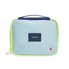 a small blue and green bag with the state logo on it's front pocket