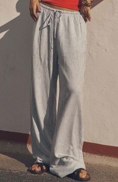 Discover the comfort of our Lightweight wide leg pant with elastic waistband by Cotton on Style to sit mid or low rise Relaxed full leg length Lightweight natural fabric Elastic waist with draw cord Warm gentle machine wash Do not bleach Line dry Hot iron Do not dry clean Striped Linen Pants Outfit, Elemental Blue, Outfits Timeless, Fire Clothes, Cotton Pants Women, Striped Linen Pants, Size 12 Women, Oversized T Shirts, Clothing Pants